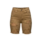 A pair of tan distressed denim shorts with ripped details and frayed edges, shown against a solid gray background.
